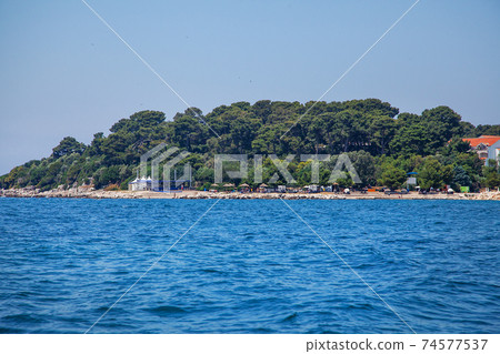 View from the sea on the old historic town of Porec, Croatia. View from the sea on the old historic town of Porec, Croatia. 74577537
