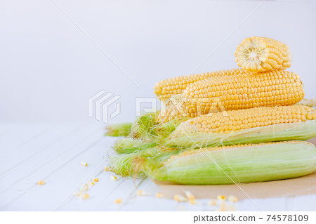 Fresh corn on cobs on rustic wooden table, closeup Fresh corn on cobs on rustic wooden table, closeup 74578109