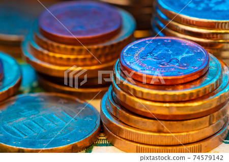 Close up of coins stacked on each other 74579142