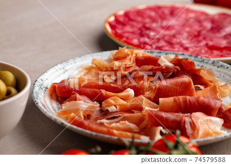 Delicious meat slicing on plate close up 74579588