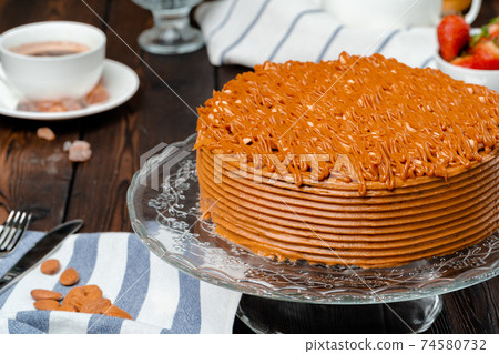 Plate with delicious caramel cake close up Plate with delicious caramel cake close up 74580732