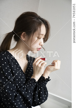 Women painting nails Women painting nails 74581051