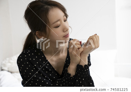 Women painting nails Women painting nails 74581225