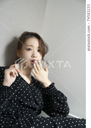 Women painting nails 74581233