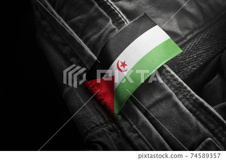 Tag on dark clothing in the form of the flag of the Sahrawi Tag on dark clothing in the form of the flag of the Sahrawi 74589357