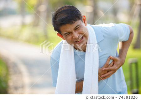 asian elderly or senior man touching chest having painful. asian elderly or senior man touching chest having painful. 74591826