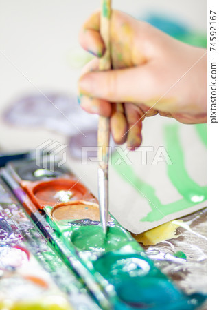 Little girl using watercolour at home during the pandemic lockdown Little girl using watercolour at home during the pandemic lockdown 74592167