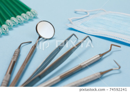 Set of metal dental instruments for teeth care 74592241