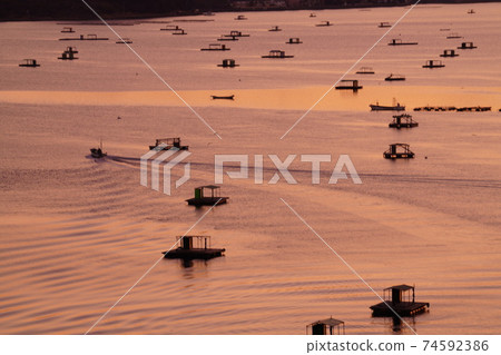 Fishing boats returning to the port 74592386