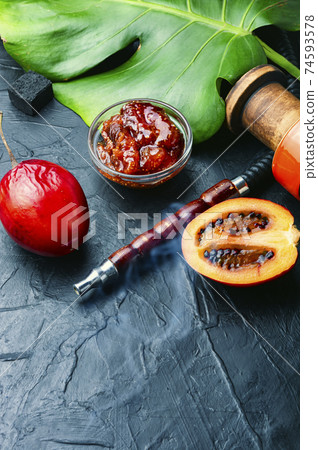 Oriental smoking hookah with tamarillo Oriental smoking hookah with tamarillo 74593578