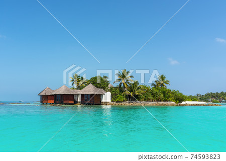 Landscape with a small island in the Maldives, Indian Ocean, Kaafu Atoll, Kuda Huraa Island Landscape with a small island in the Maldives, Indian Ocean, Kaafu Atoll, Kuda Huraa Island 74593823