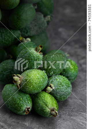 Feijoa whole on black background. Exotic fruit. Selective focus. Closeup. Feijoa whole on black background. Exotic fruit. Selective focus. Closeup. 74593881