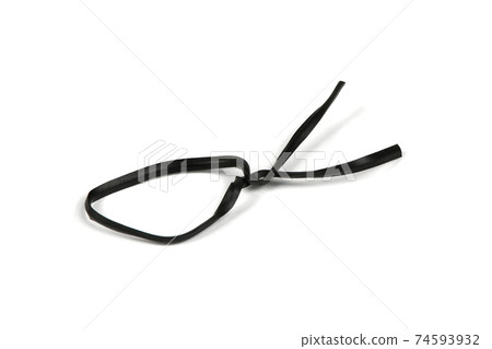 Black plastic coated wire tie used for a variety of things on white background. Black plastic coated wire tie used for a variety of things on white background. 74593932