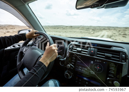 Driving off road car in the desert 74593967