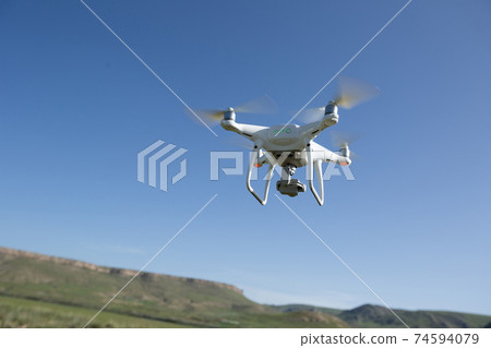 Flying drone taking photo of  landscape in China 74594079