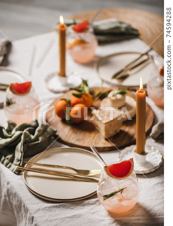 Home cocktail party table setting with cocktails 74594288