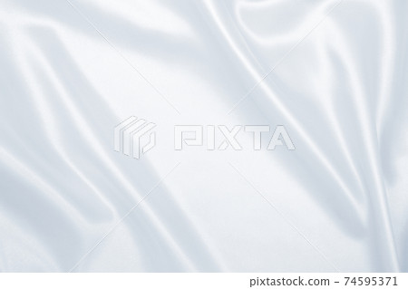 Smooth elegant grey silk or satin luxury cloth as wedding background. Luxurious background design Smooth elegant grey silk or satin luxury cloth as wedding background. Luxurious background design 74595371