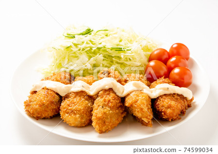 Fried oysters with tartar sauce. (White plate / white background) Fried oysters with tartar sauce. (White plate / white background) 74599034