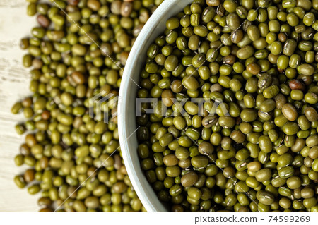 Raw cereals or beans in glass jars close up. Vegan and vegetarian food. Raw cereals or beans in glass jars close up. Vegan and vegetarian food. 74599269