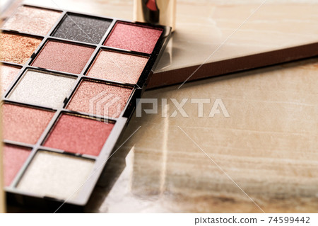 Close up of new matte eyeshadow colorful shades palette. Close up of new matte eyeshadow colorful shades palette. 74599442