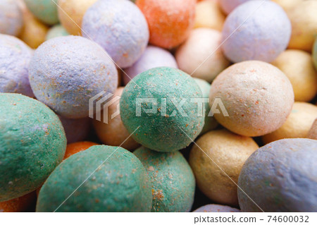 Multicolored make-up powder in balls close up Multicolored make-up powder in balls close up 74600032
