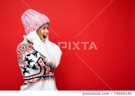 Side-profile photo of pretty astonished amazed happy young blonde woman standing isolated over 74600146