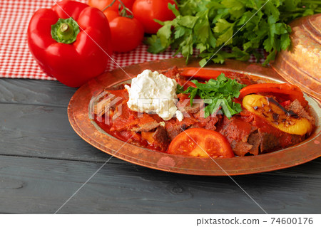 Turkish Meat Saute with vegetables in copper plate 74600176