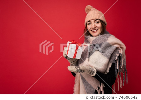 Beautiful happy young brunette woman isolated over colourful background wall wearing stylish casual 74600542
