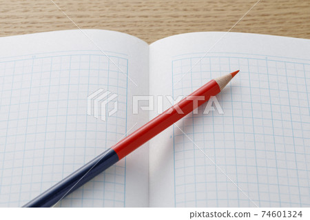 Red-blue pencil and grid notebook 74601324