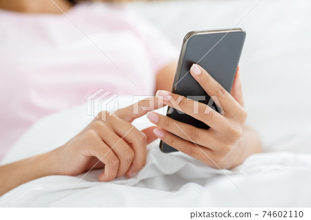 Surfing in internet, write blog post in modern device during covid-19 quarantine 74602110