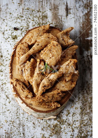 cooked spiced mock chicken meat strips cooked spiced mock chicken meat strips 74602380