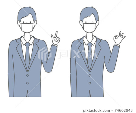 一個穿著西裝的男人戴著面具指著他的手指,給一個好的跡象 一個穿著西裝的男人戴著面具指著他的手指,給一個好的跡象 74602843