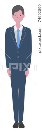 A man in a suit standing straight 74602890