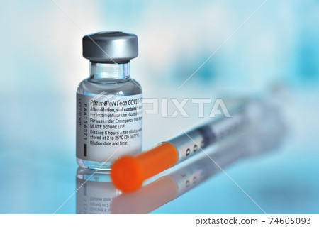 Galati, Romania - February 16, 2021: Pfizer-BioNTech COVID-19 Vaccine "comirnaty" ampoule 74605093