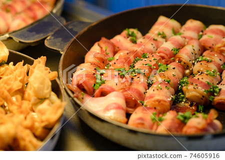 Prawn wrapped with bacon and rosemary. baked appetizer. Close-up shot. 74605916