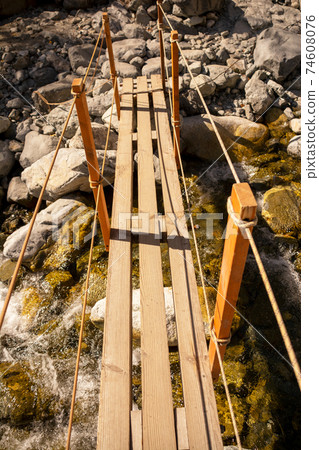 Honya Bridge, a resting point between Kamikochi and Karasawa in the Shinshu Northern Alps. Mountain trails, bridges. Azusa River. 74608076