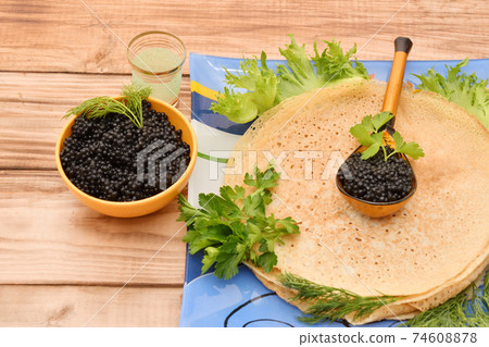 Pancakes with black caviar Pancakes with black caviar 74608878