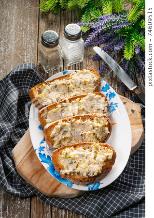 Sandwiches with a paste of mackerel, egg and cucumber. Sandwiches with a paste of mackerel, egg and cucumber. 74609515