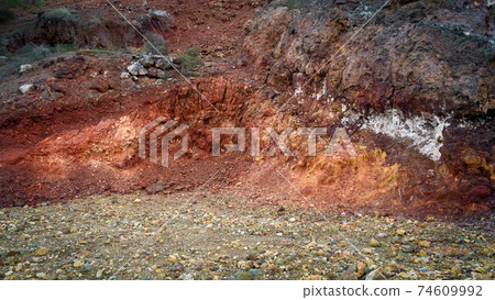 Red rocks in mining area rich with iron and copper ore 74609992
