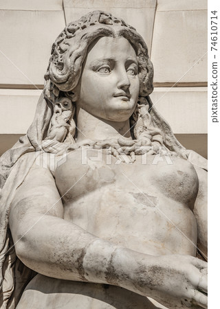 Statue of sensual busty and puffy renaissance era woman in Vienna, Austria, details, closeup 74610714
