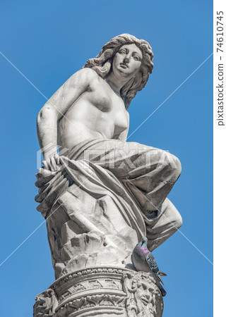 Beautiful topless girl as summit of State Opera fountain in Vienna in front of blue sky, Austria, details, closeup Beautiful topless girl as summit of State Opera fountain in Vienna in front of blue sky, Austria, details, closeup 74610745