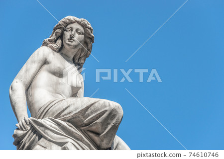 Beautiful topless girl as summit of State Opera fountain in Vienna in front of blue sky, Austria, details, closeup Beautiful topless girl as summit of State Opera fountain in Vienna in front of blue sky, Austria, details, closeup 74610746