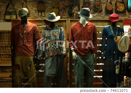 Mannequins dressed in casual clothes in shopping mall. 74611071