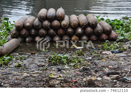 A lot of propane gas placed along the river Shodrugat at Dhaka, Bangladesh 74612110