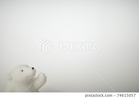 Polar bear figurine facing right and raising left hand Polar bear figurine facing right and raising left hand 74615057