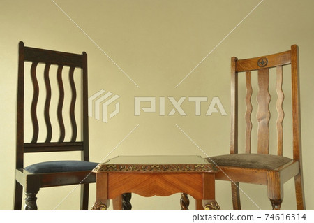 Mahogany table and oak chair. Layout of British antique furniture (copy space, soft focus) Mahogany table and oak chair. Layout of British antique furniture (copy space, soft focus) 74616314