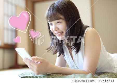 Image of a young woman emailing her favorite person Image of a young woman emailing her favorite person 74616853