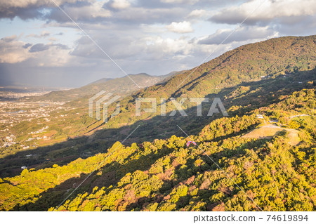 A paraglider that blends into the scenery of the autumnal mountains, Kinokawa City, Wakayama Prefecture A paraglider that blends into the scenery of the autumnal mountains, Kinokawa City, Wakayama Prefecture 74619894