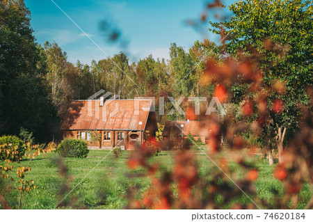 Berezinsky, Biosphere Reserve, Belarus. Traditional Belarusian Tourist Guest Houses In Early Autumn Landscape. Popular Place For Rest And Active Eco-tourism In Belarus 74620184