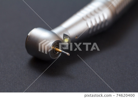 Dental instruments for teeth dental care on black background 74620400